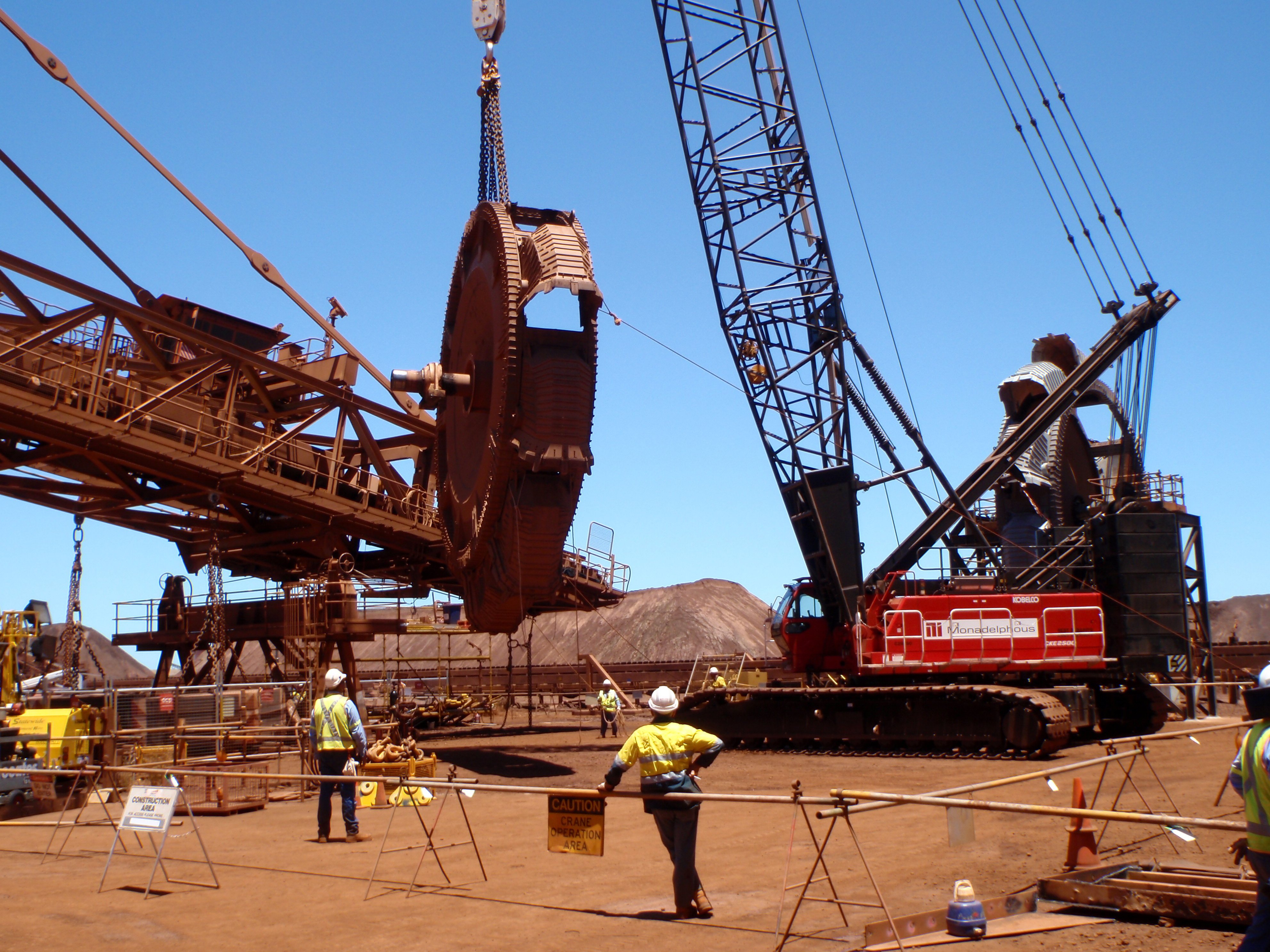 Bucket wheel changeout during major maintenance of a balanced machine at a bulk materials handling facility in Western Australia. Engineering support for bucket wheel replacement on balanced machine equipment in the mining industry.